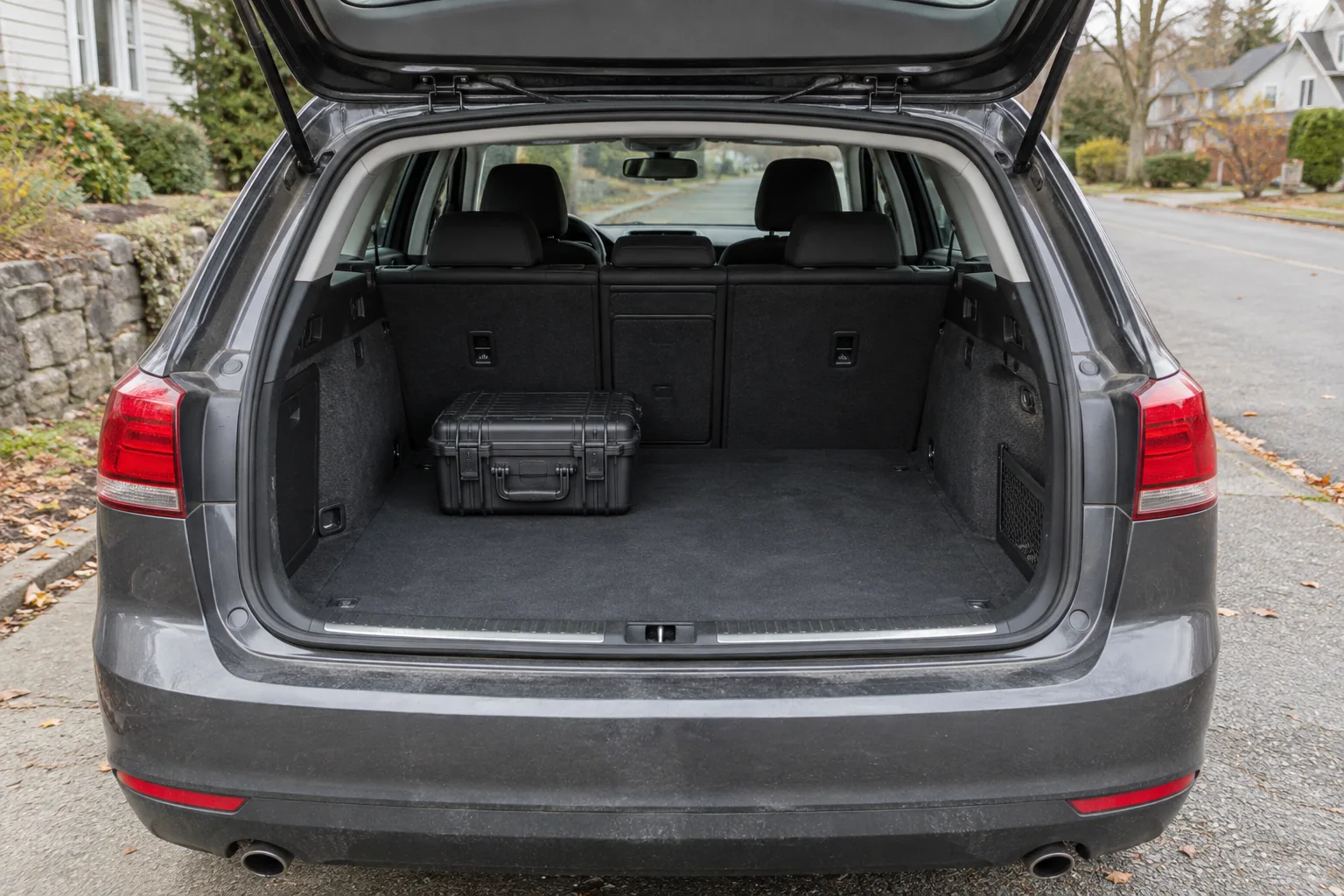 Open station-wagon hatch with a closed case in the cargo area